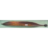 An aboriginal woomera with hook and resin grip,