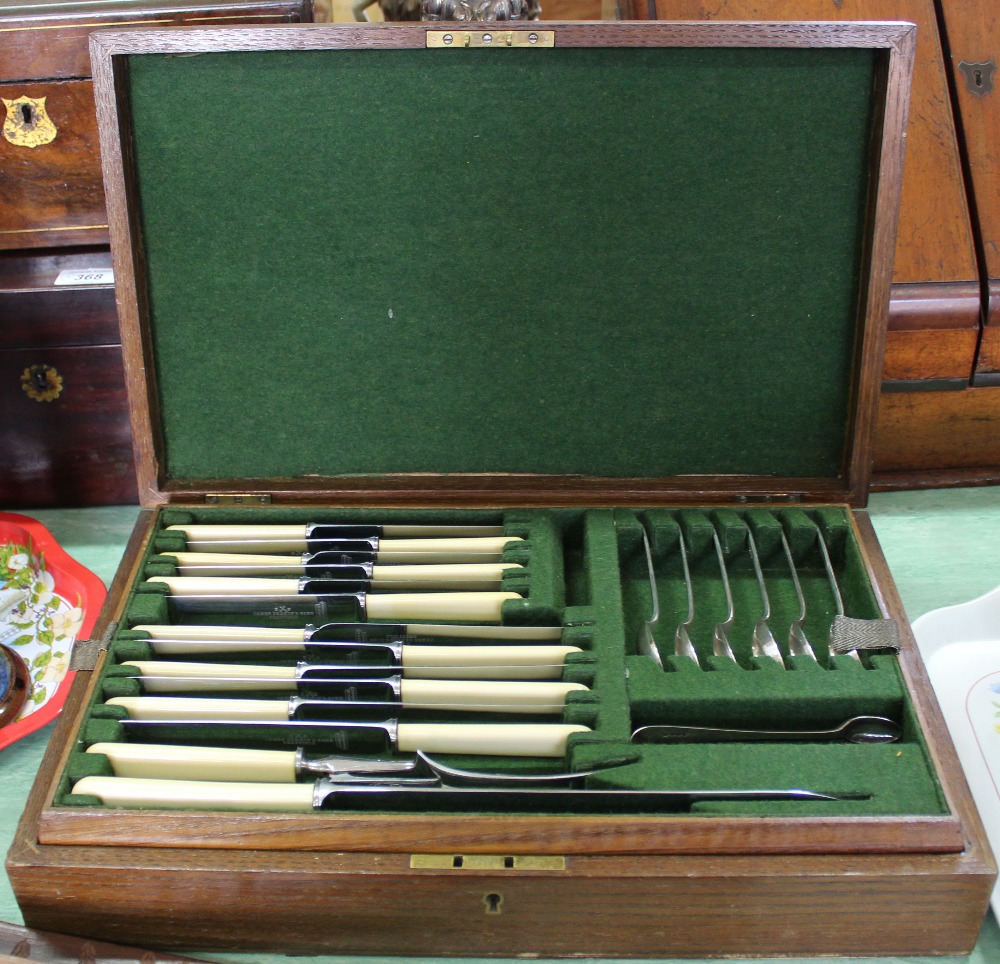 An oak canteen of silver plated cutlery