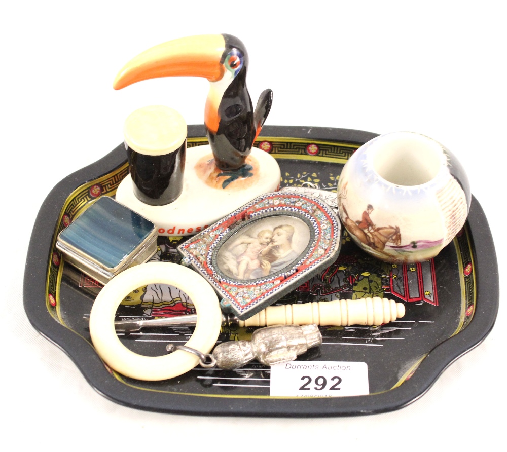 A Carlton ware Guinness toucan, a pottery match striker,