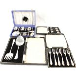A cased set of six silver coffee spoons plus three cases of silver plated cutlery