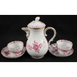 A Meissen pink floral coffee pot plus two cups and saucers