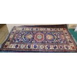 A Persian rug with three geometric medallions,