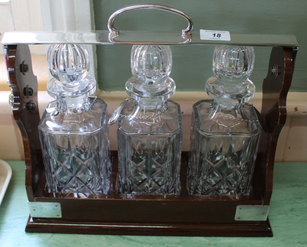 A modern three bottle Tantalus