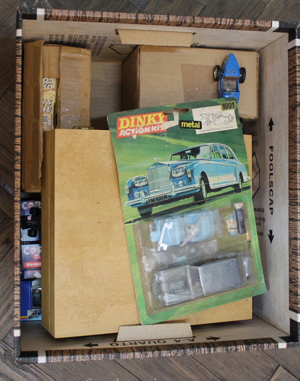 Various die cast models including red and blue boxed Corgi