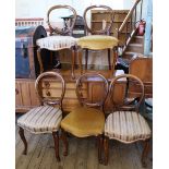 A set of five Victorian mahogany hoop back dining chairs