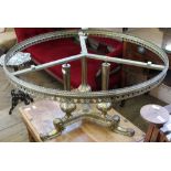 An ornate brass occasional table with galleried top (as found)