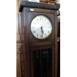 A 1920/30's oak long case clock