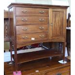 An Edwardian inlaid mahogany four drawer chest on legs with cupboard and undertier