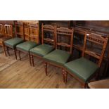 Five Edwardian oak and leatherette dining chairs