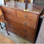 An Edwardian oak chest of two short and three long drawers