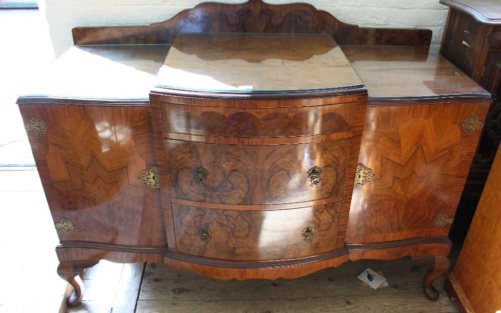 A bow fronted sideboard with burr walnut veneer,