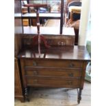 An Edwardian three drawer chest on barley twist legs and a reproduction wine table