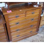 An Edwardian oak chest of two short and three long drawers