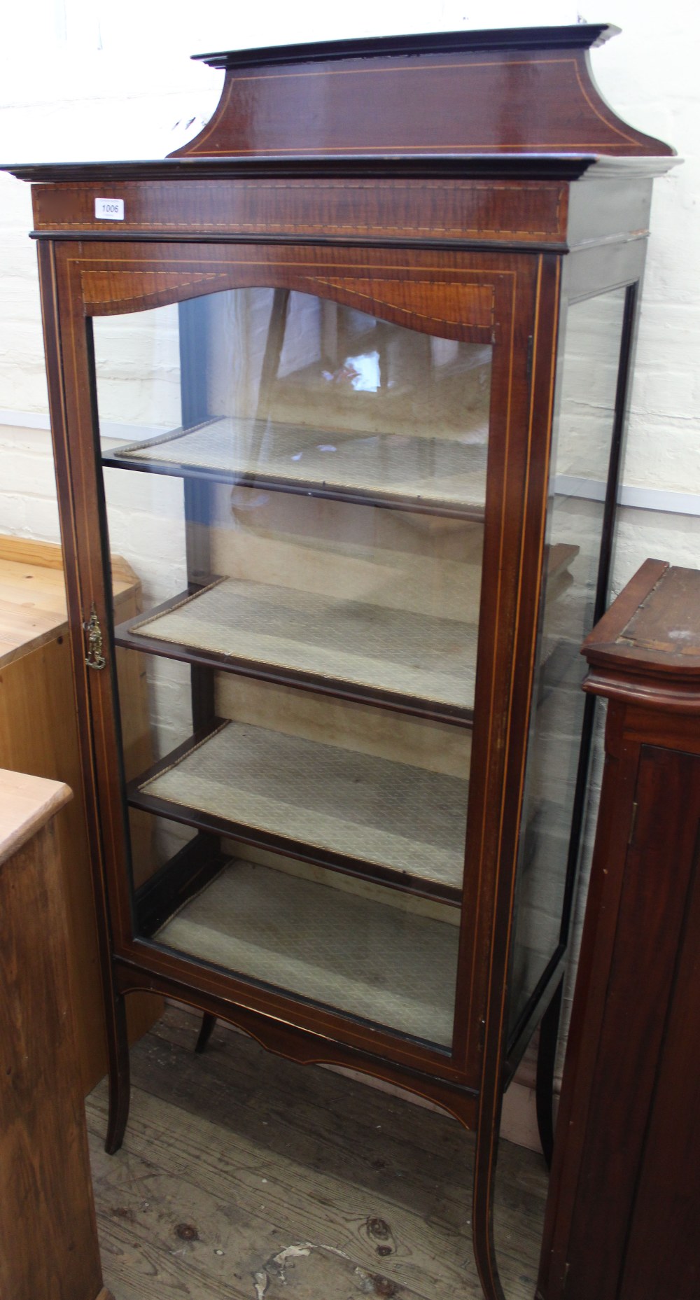 An Edwardian mahogany inlaid glazed display cabinet