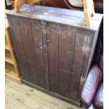 An Edwardian pine two door cupboard