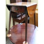 An Edwardian splayed leg circular drop leaf table with single drawer