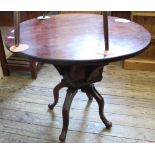 A Victorian circular revolving table