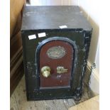 A small vintage safe bearing plaque stating "Burglar and Fire Resisting Safe Registered Trademark"