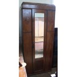 An oak single wardrobe with mirrored door