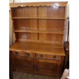 A 1920's light oak dresser with two drawers and two doors