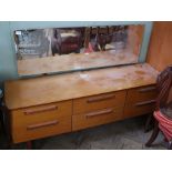 A retro 1970's G Plan dressing table with six drawers and mirror top