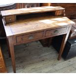 A modern two drawer desk on tapered legs with two drawer upstand