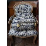 A French oak upholstered armchair,