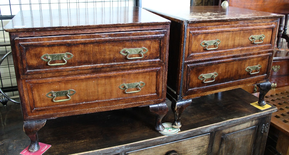 A pair of two drawer bedside cabinets