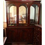 A large solid glazed top cabinet with three cupboards below