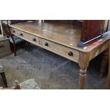 A very long, substantial pine farmhouse kitchen table with three drawers, length 108 inches,