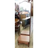 A long and low oak glazed bookcase on legs and a cheval dressing mirror with single drawer base