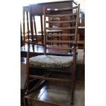 A modern oak upholstered ladder back rocking chair