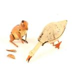 A tin plate penny toy goose with nodding head plus a rabbit with moveable arms