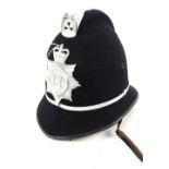 A Police helmet bearing Suffolk Constabulary insignia plate