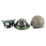 Two helmets with a peaked cap