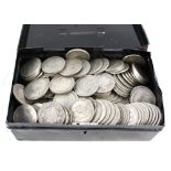 A cash tin containing GB silver half crowns