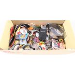 A box of various pin badges