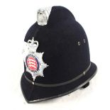 A Police helmet bearing Essex Police insignia plate