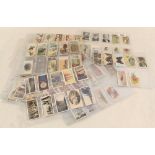 Various cigarette cards in sleeves