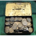 A cash tin containing GB silver shillings