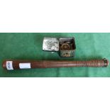 A wooden truncheon with a tin of military buttons etc