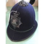 A Police helmet bearing Hertfordshire Constabulary insignia plate