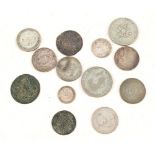 An Elizabeth I shilling (as found) plus other coins, 18th-20th Century,