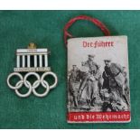 A German '1936' Olympics enamelled badge with small Third Reich photograph booklet