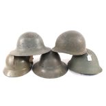 Five various tin helmets