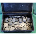 A cash tin containing GB silver shillings