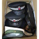 Three British Police caps with another and belts etc