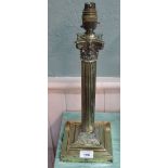An Edwardian Corinthian column brass table lamp with fluted decoration,
