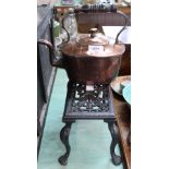 A Victorian copper kettle plus an iron trivet