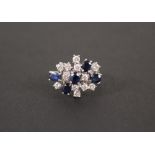 An 18ct white gold sapphire and diamond cluster ring,